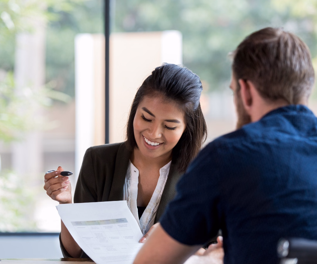 Buyer Signs His Camper Loan Contract In An Office
